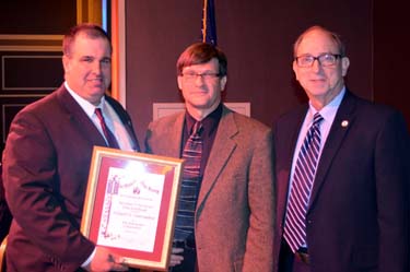 Photo of NJ State Board of Agriculture President Richard Norz and Secretary Fisher presenting Richard VanVranken with his award