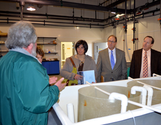 Photo of officials touring the Aquaculture Innovation Center