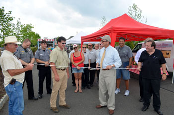 Photo of Secretary Fisher cutting the ribbon for a new season at the Chesterfield Farmers Market