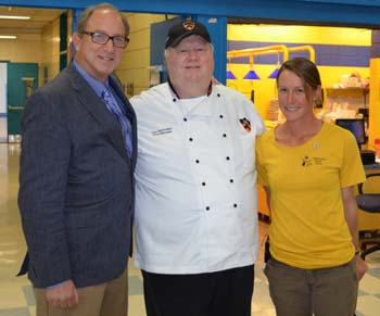 Photo of Secretary Fisher with Chef Dan Slobodien and farmer Jess Niederer