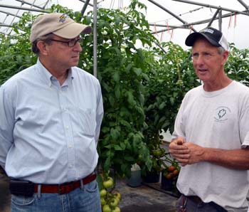 Photo of Secretary Fisher and John Dooley in his greenhouse