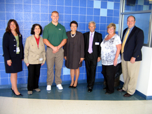 Photo of the Jets Mulligan with officials at Hightstown High School