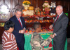 Photo of Senator Menendez and Secretary Kuperus handing out apples