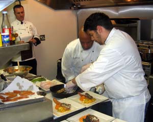 Photo of chefs preparing black sea bass dish