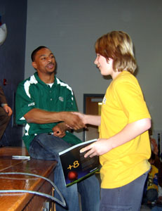 Photo of Chansi Stuckey handing out a prize