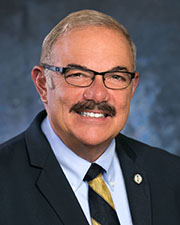 James T. Plousis, Chairman
