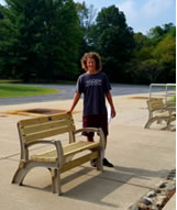 Logan Kellenberger with benches she constructed
