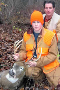 Youth and dad with deer Youth and dad with deer