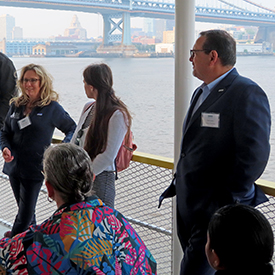 NJDEP's Elizabeth Dragon talks toattendees about the state's work to helpredevelop land along the waterfront intoparks. Photo by the DRBC.