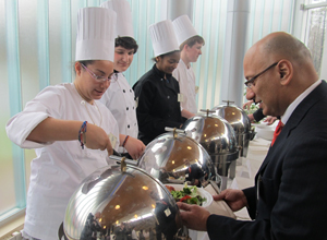 Culinary students serve up samples of their work to NJ State Board of Education President Arcelio Aponte.