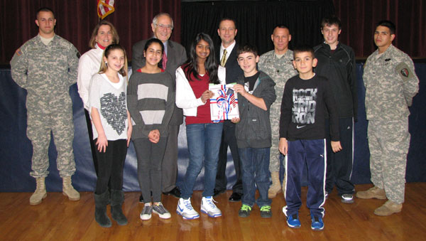 Woodcliff Lake Superintendent Lauren Barbelet, Middle School Principal Jack Leonard, NJ State School Board Vice Chair Ilan Plawker, Lt.Col. Mark Piterski and Woodcliff Middle School Students at the Holiday Greetings for U.S. Military Assembly in Bergen County