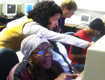 NJ HELPS - Human Services Commissioner Jennifer Velez and Division of Family Development Food Stamp Coordinator Mary Beth Scheadel assist Trenton Area Soup Kitchen clients Nancy Gbor and Tristan Marreno to use NJHelps, a website that New Jersey residents can use to screen themselves for more than 30 social service programs.