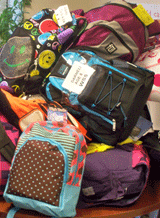 Back to School Backpacks pile up as DHS employees donate them for children of homeless families served by HomeFront, a Mercer County agency.