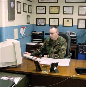 Sgt. Paul Saindon in his office at the Headquarters and Headquarters Company, 2nd Battalion, 113th Infantry. Photo courtesy of Capt. Robert K. Bryan