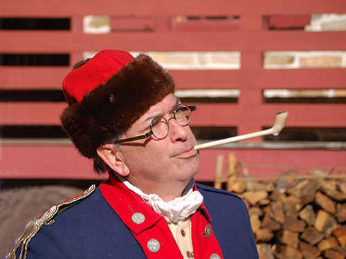One of the historical intepreters of the Old Barracks strikes a pose during Patriots' Week activities