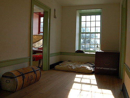 Second floor hallway of the officers' quarters - note the servant's bedding and officers' trunks