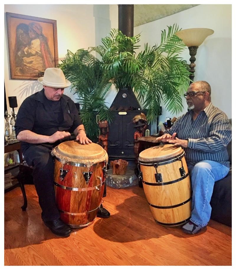Apprentice, Edwin Estremera, drumming with Master, Nelson Baez, during a one-on-one session in Nelson's home.