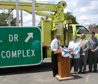 Commissioner of NJDOT unveils Governor James McGreevey's $50 million Sign Renewal Initiative to make all NJ signage more clear, concise and consistent on July 29. With him are Assemblywoman Bonnie Watson-Coleman, Trenton Mayor Douglas Palmer and Freeholder Brian Hughes. 