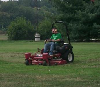 photo of student on commercial mower as a part of his sae