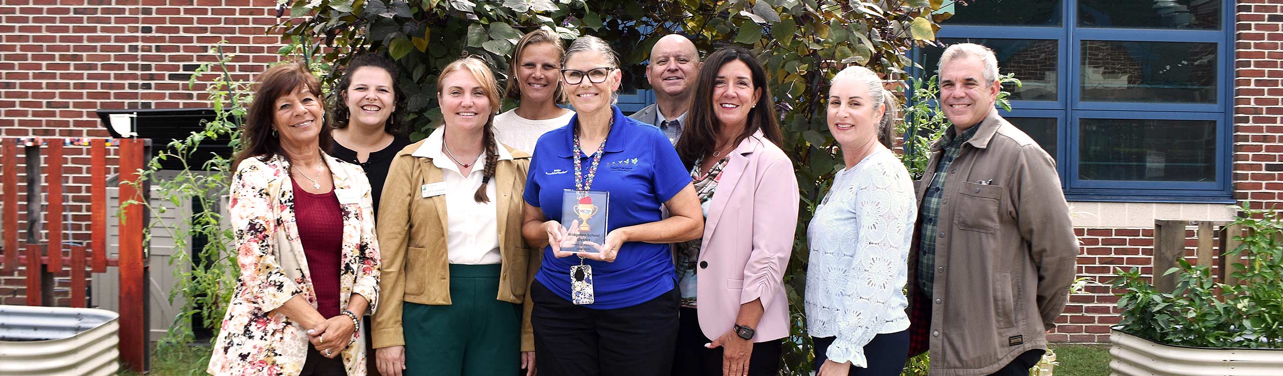 Buckshutem school dfistrict staff standing with New Jersey Department of Agriculture Staff for Farm to School week.