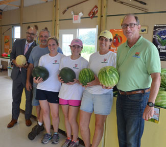 Photo of Secretary Fisher and Assemblyman Adam Taliaferro at Grasso Girls Market