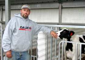 Photo of Will Sytsema on his farm, Windy Flats Dairy