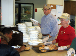 Photo of Secretary Fisher at Soup Kitchen