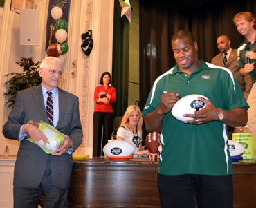 Photo of School Superintendent Cavanna and D'Brickashaw Ferguson