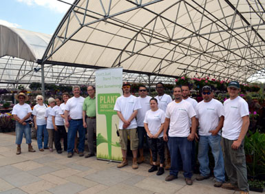 Photo of Secretary Fisher at Condursos Garden Center for Plant Something Week