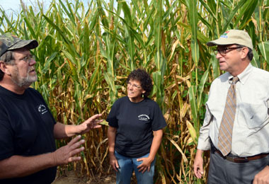 Photo of Jim and Caroline Etsch with Secretary Fisher in their corn maze