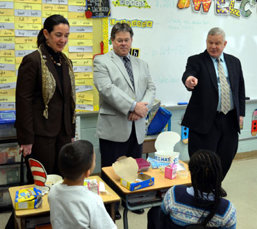 Photo of Rose Tricario, James Harmon and Dr. Doran observing breakfast in the classroom