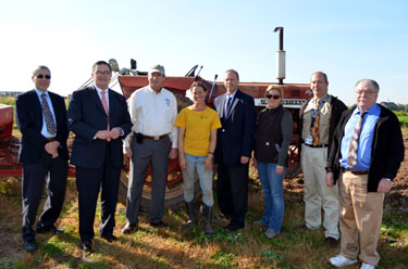 Photo of Secretary Fisher and other officials with Jessica Niederer