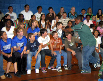 Photo of Chris Davis greeting Rittenberg students