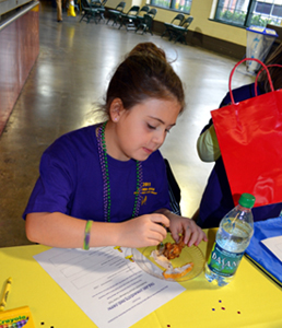 Photo of an Old Bridge student doing a taste test.