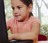 photo of girl by the computer