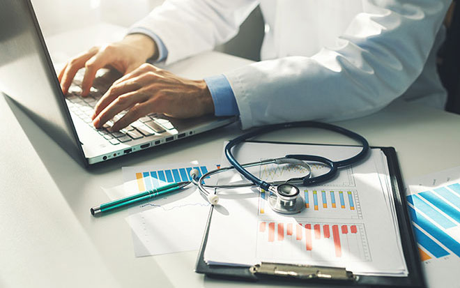  Doctor using a laptop