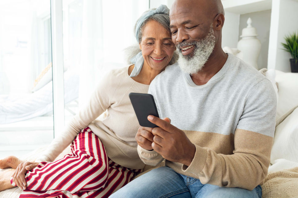 older couple viewing a cell phone