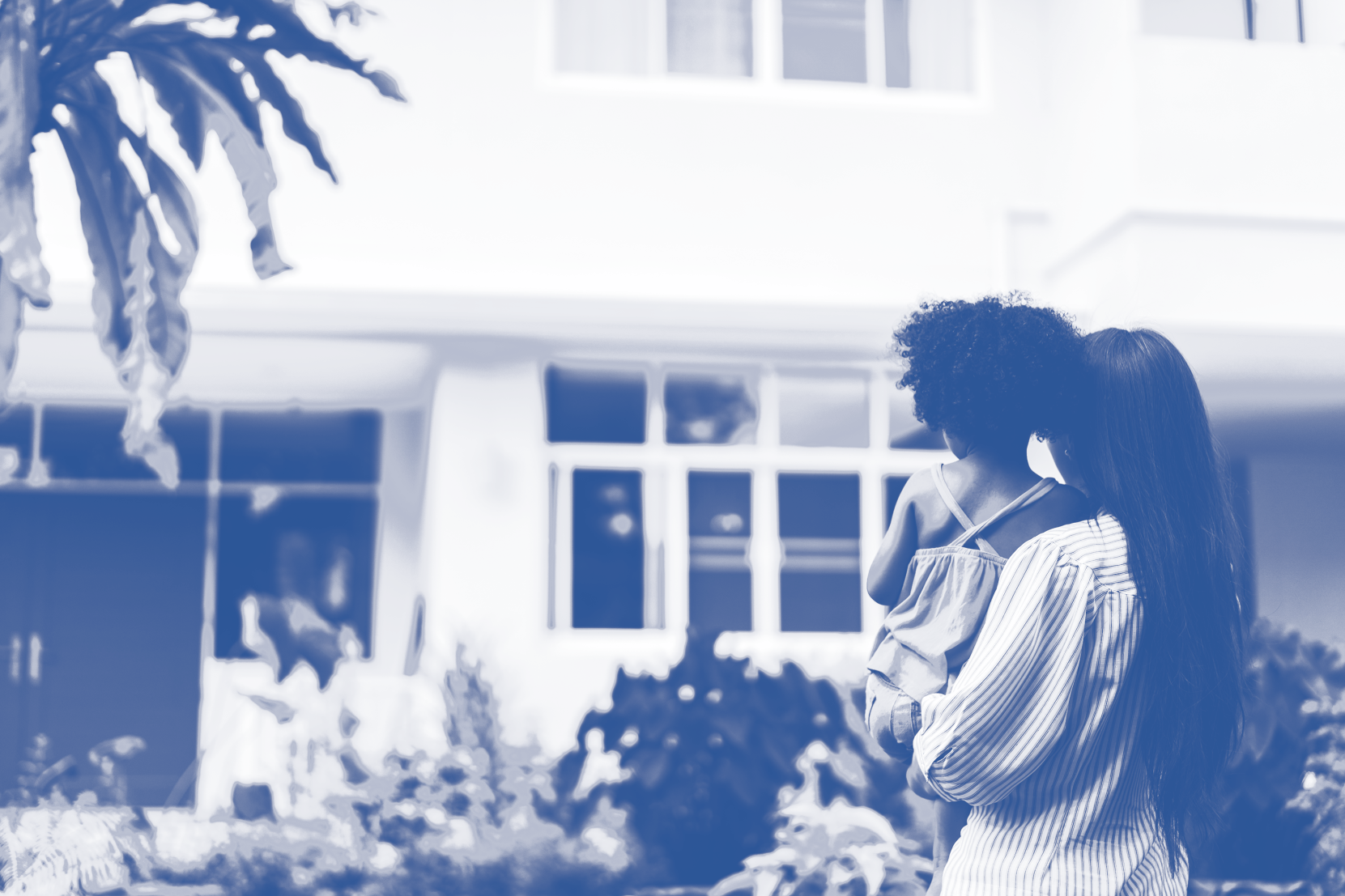 mother and daughter in front of home