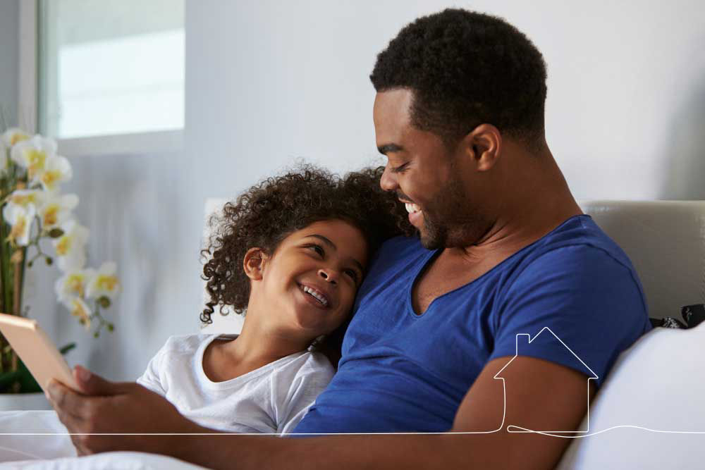 father and daughter on a couch