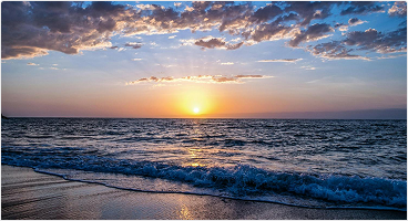 A photo of a sunrise by the beach
