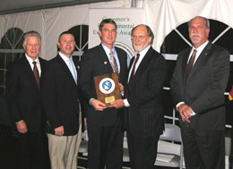(left to right) Brian Feldman of TruGreen and Chris Wible of Scott’s MiracleGro receiving a Water Resources Environmental Excellence Honorable Mention Award from Governors Florio and Corzine and NJDEP Acting Commissioner Mauriello.