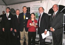 (Left to right) John Caddock, Matt Ericson and Paula Pilipovic of HelpLight NJ receiving an Environmental Excellence Award in the Environmental Education category from Governors Florio and Corzine and NJDEP Acting Commissioner Mauriello.