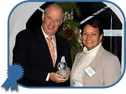 NJDEP Commissioner Lisa Jackson awards the Governor’s Environmental Excellence Award for Environmental Leadership to Dr. Kevin Lyons, Director of Purchasing at Rutgers University for his applied research and implementation of environmentally-friendly and socially-responsible purchasing at the University.