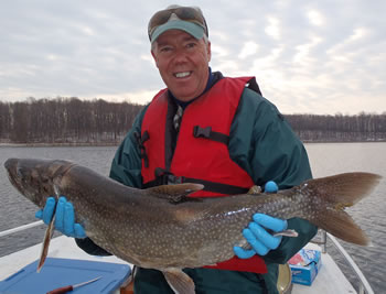 Biologist with lake trout