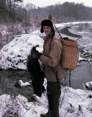 Young trapper with beaver