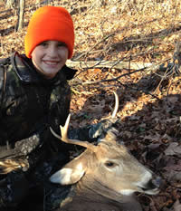 Happy and proud youth with first buck Happy and proud youth with first buck