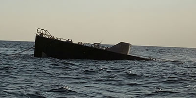 Caisson sinking on reef site