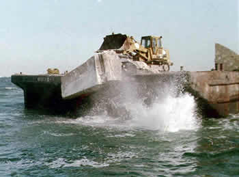 Concrete being deployed from barge