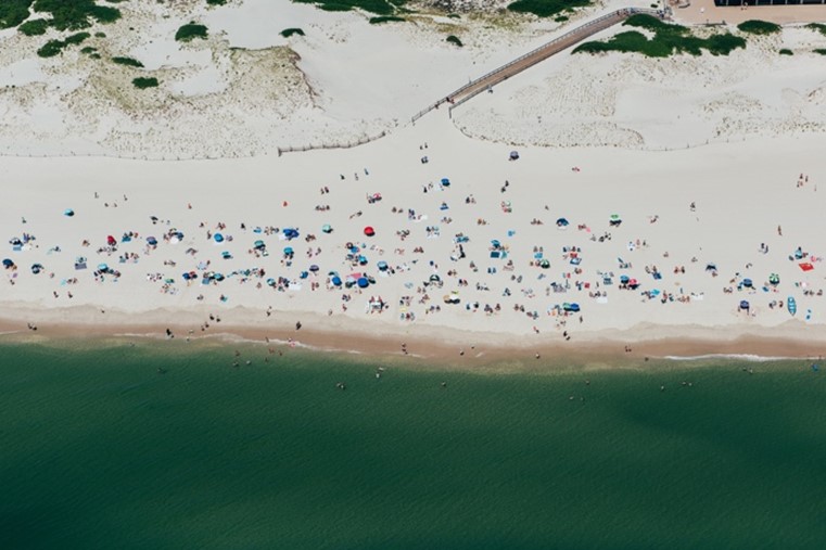 Photo-overhead view of beachgoers