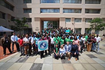 A group of people posing for a photo  Description automatically generated with medium confidence